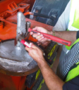 Use small hammer and an heavier hammer (not moving) to remove concrete on free standing probe